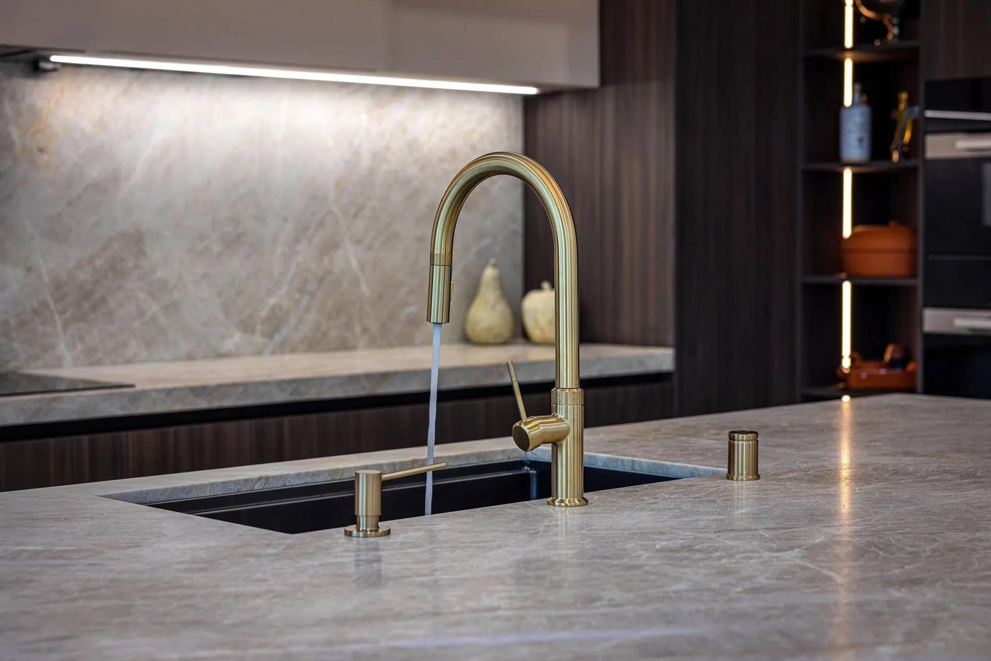 Brass faucet and stone countertop detail