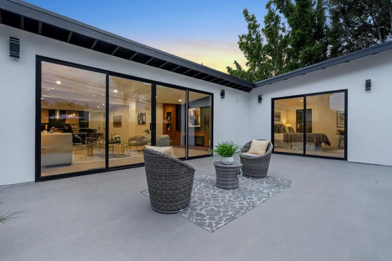 Luxury outdoor living space behind a home