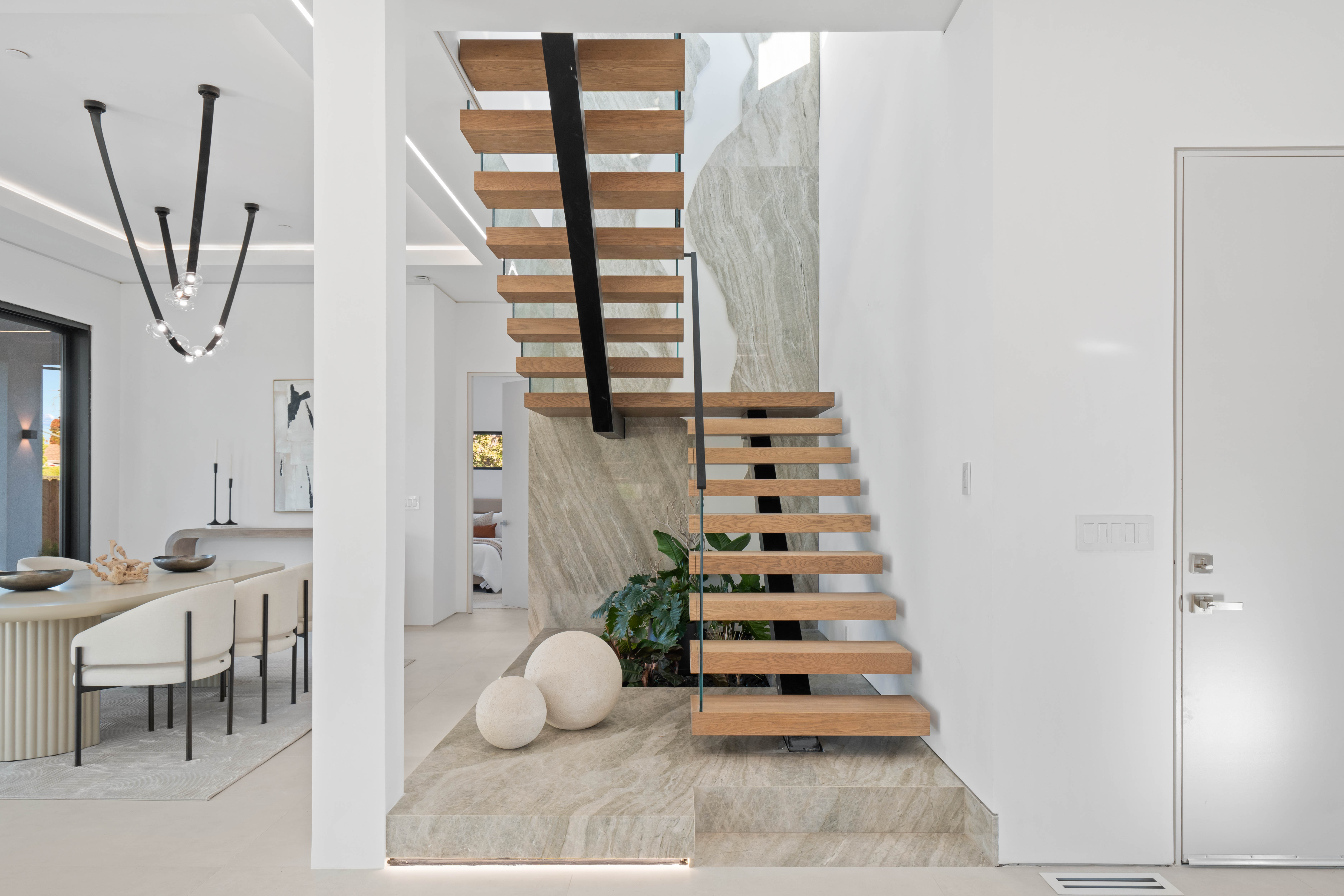 Luxury home addition and renovation featuring expanded living spaces and modern design elements