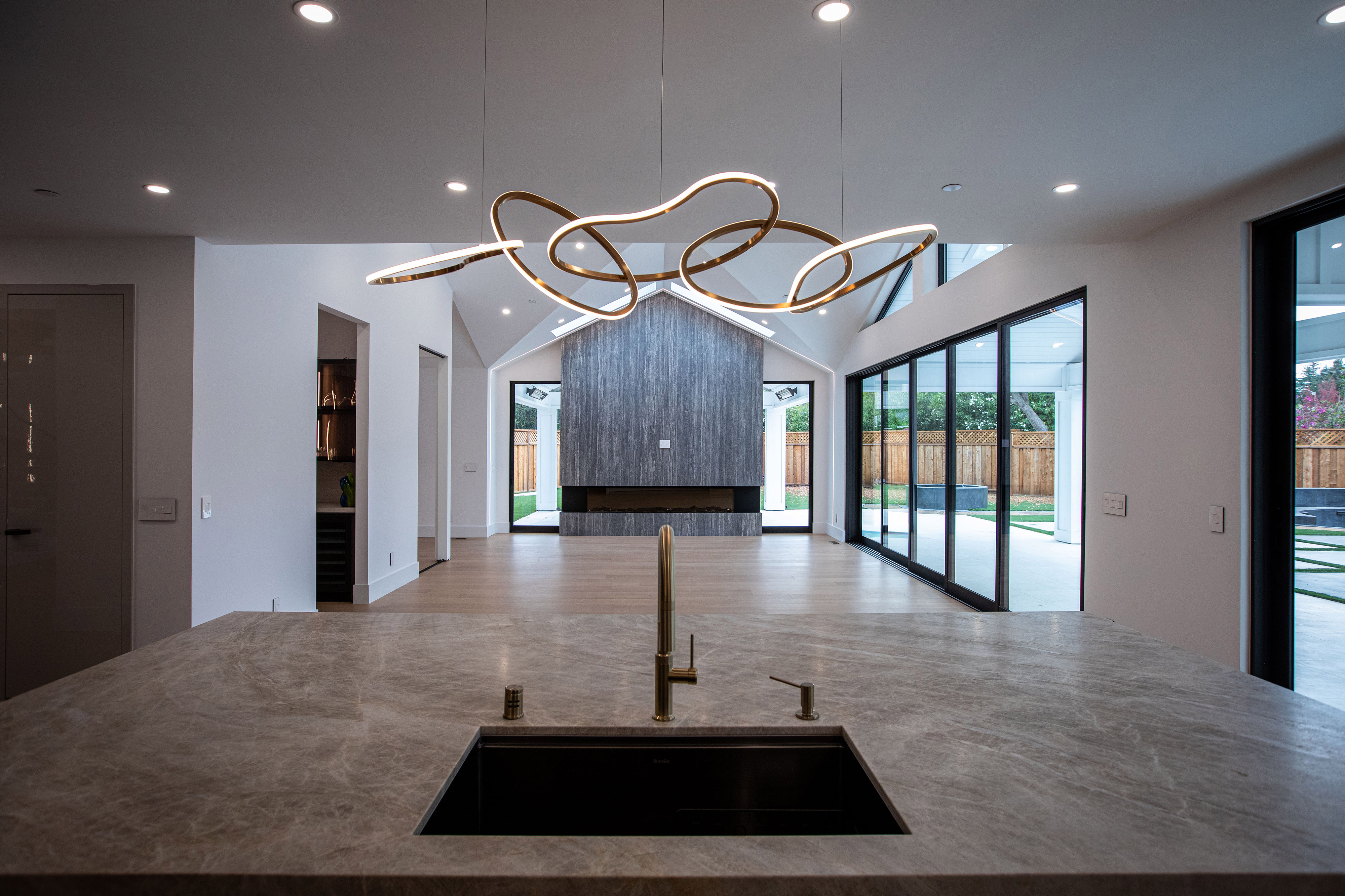 Modern luxury kitchen featuring integrated smart home lighting, custom millwork, and high-performance appliances.