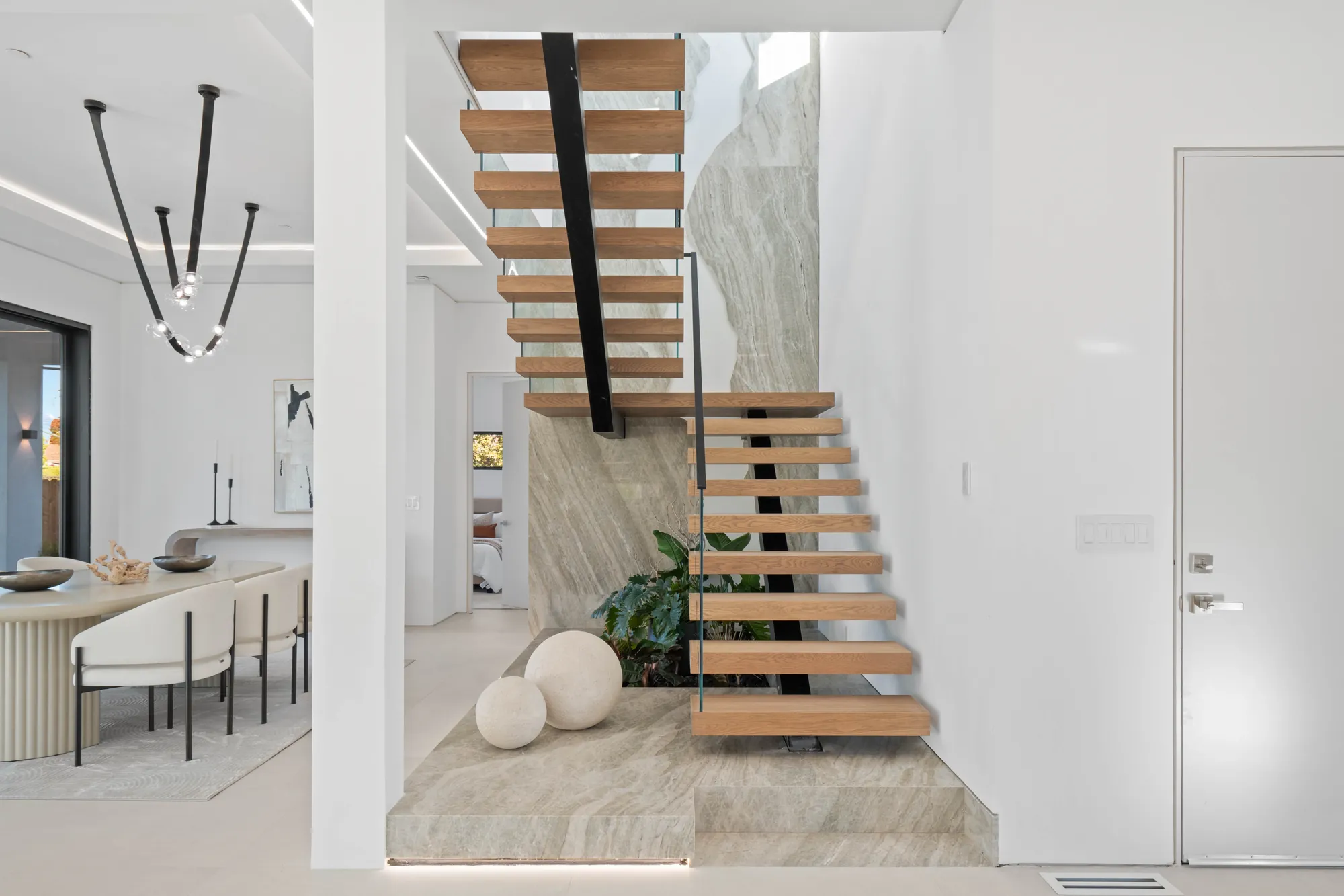 Custom interior shot of Atherton California home floating stairs which were designed and built by Ritz Builders
