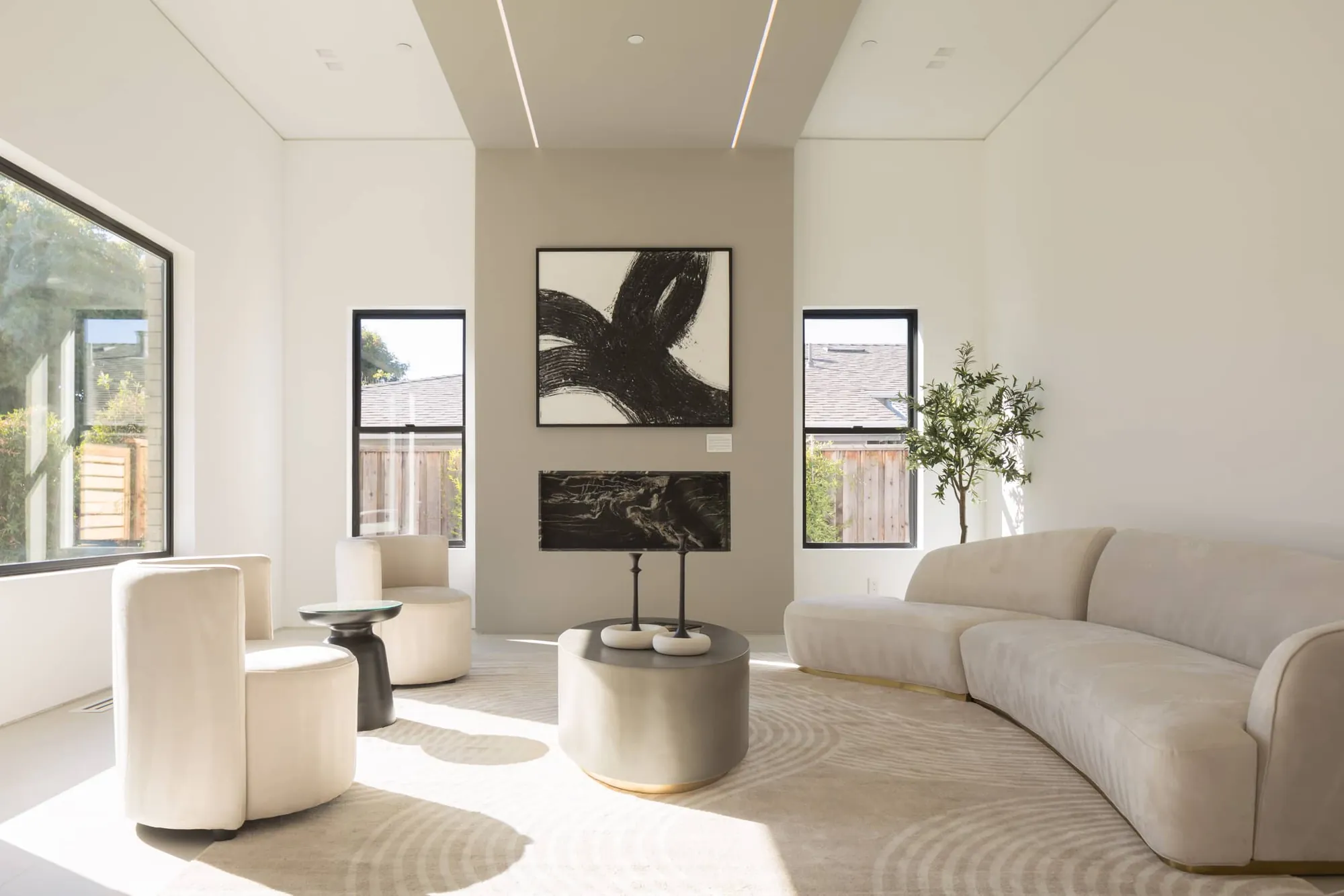 High-ceiling modern living area in Cupertino with custom architectural detailing and premium finishes by Ritz Builders.