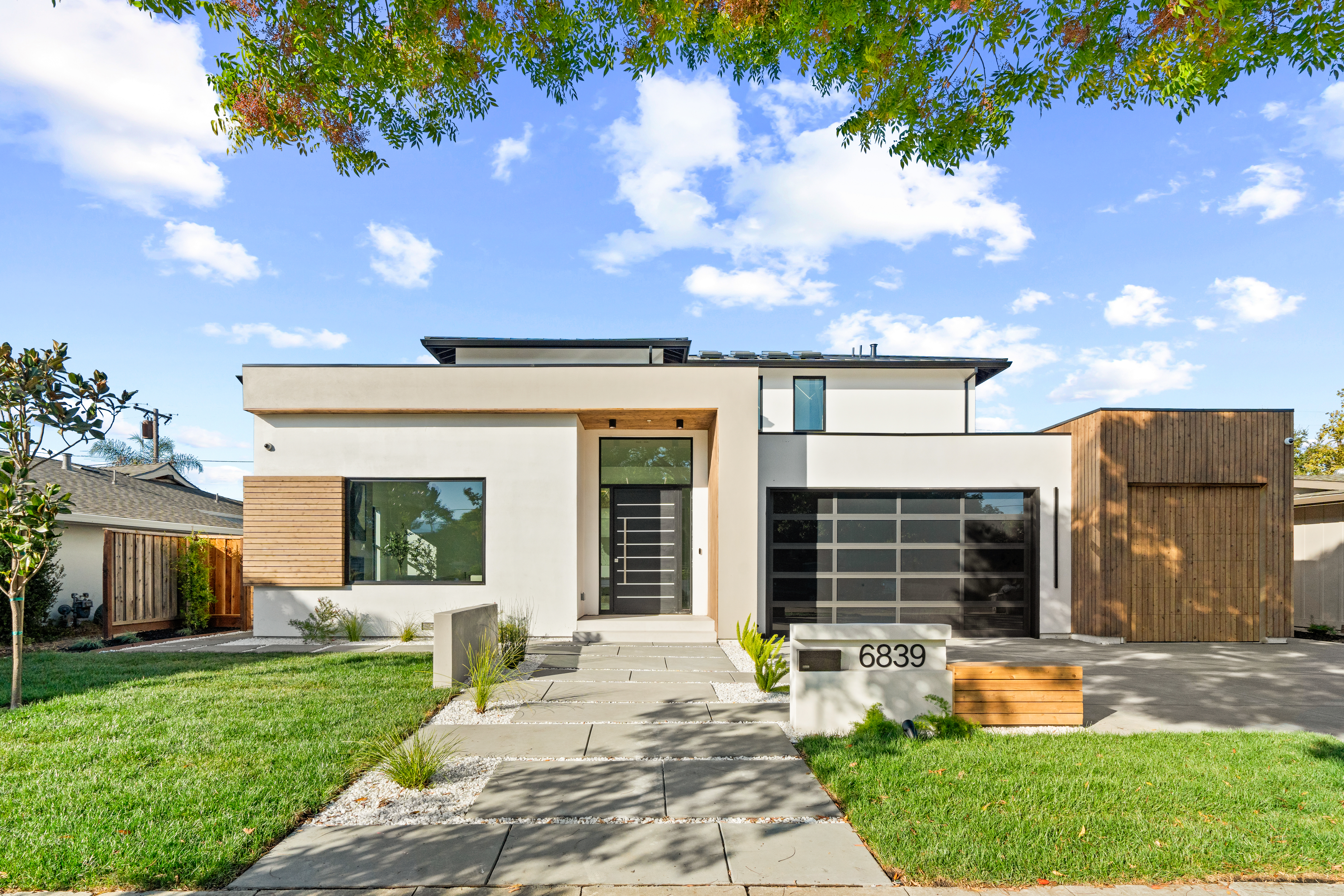modern custom Emerald Hills home integrated into a hillside elevation designed and built by Ritz Builders